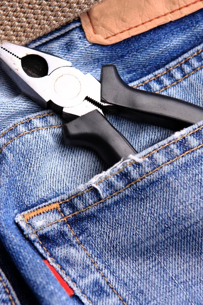 Pliers in the jeans' pocket — Stock Photo, Image