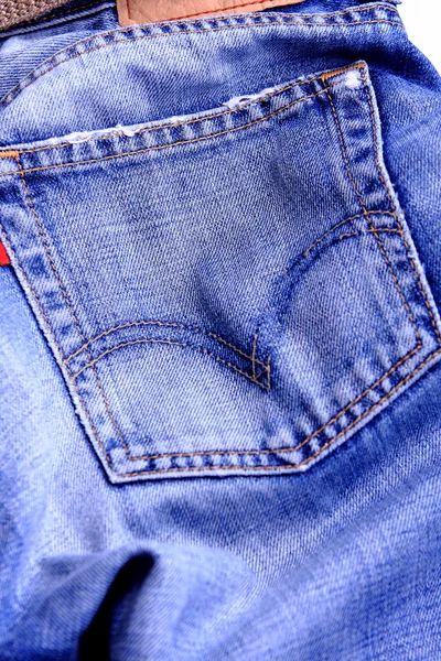 Fragment of blue modern jeans with pocket, can be used as a back — Stock Photo, Image