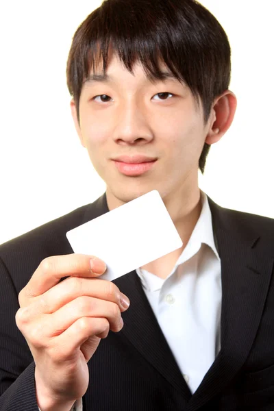 Empresário com cartão vazio na mão — Fotografia de Stock