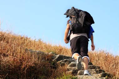 Sport hiking in mountains, walking and backpacking clipart