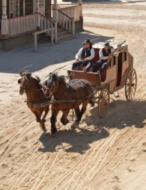 Sheriff and his Deputy driving a stagecoach clipart