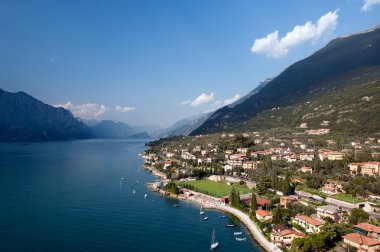 Lake Garda is the largest lake in Italy. It is located in Northern Italy, about half-way between Brescia and Verona, and between Venice and Milan. clipart