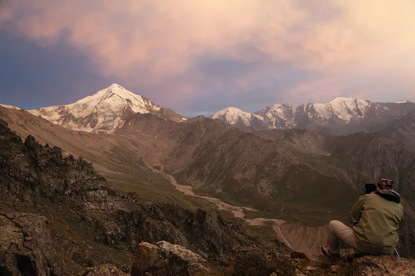 stock image Photographer in mountains at sunset