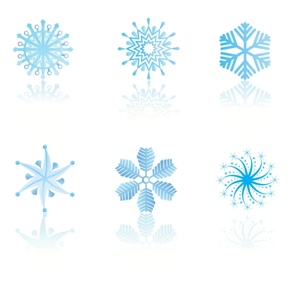 Vackra kalla crystal lutning snöflingor — Stock vektor