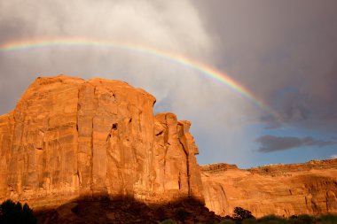 Rainbow Above Sandstone Cliff clipart