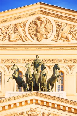 Sculptural group of the horseman on a facade of the big theater clipart