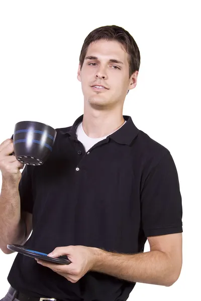 Молодой человек держит чашку кофе — стоковое фото
