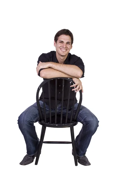 Hezký a stylový model sedí na židli — Stock fotografie