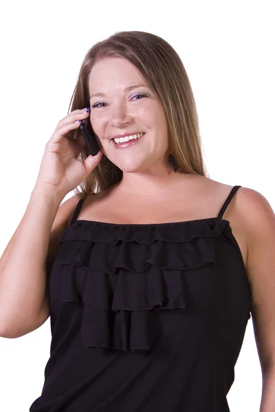 Vrolijke jonge vrouw die lacht tijdens het chatten op telefoon — Stockfoto