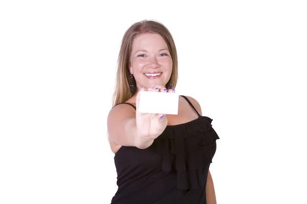 Hermosa chica sosteniendo una tarjeta de visita en blanco —  Fotos de Stock