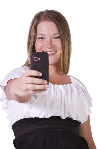 Žena s obrázky ze svého mobilního telefonu — Stock fotografie