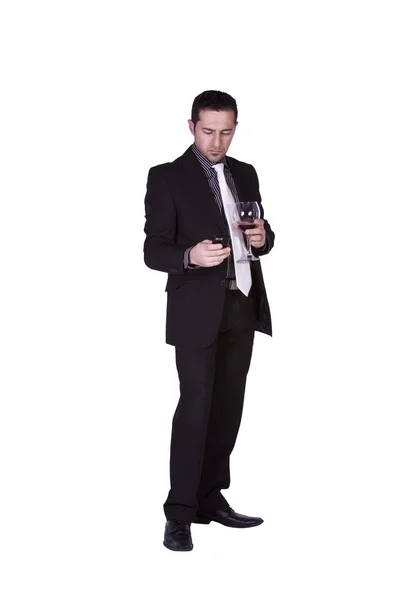 Empresario con un vaso de bebida mensajes de texto —  Fotos de Stock