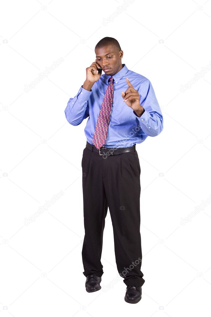 Isolated Black businessman with his hand in pocket talking on the phone