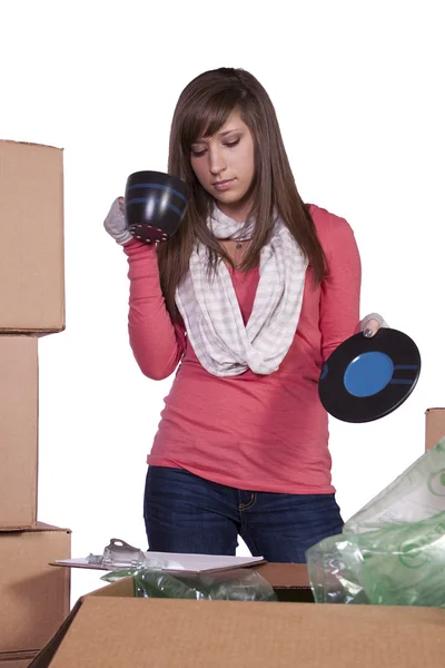 Young girl packing up and moving - isolated — Stock Photo, Image