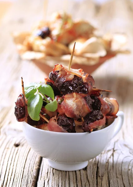 Bacon wrapped prunes — Stock Photo, Image