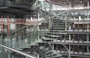 Spiral staircase in a modern building clipart