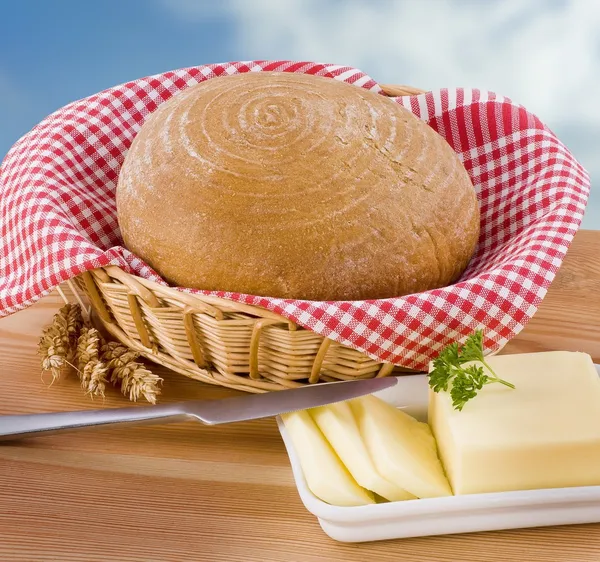 Loaf of bread and butter — Stock Photo, Image