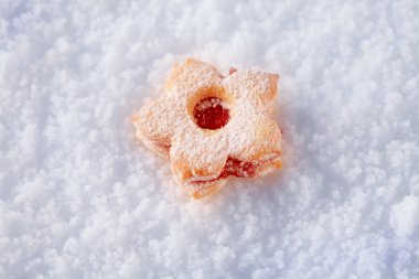 Jam biscuit on snow