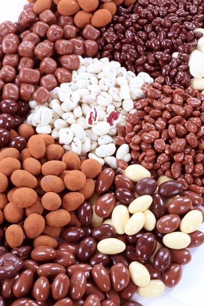 Chocolate covered nuts and fruit — Stock Photo, Image