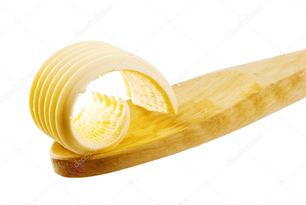 Butter curl on a wooden spoon