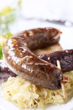 Sausages, sauerkraut and baked potato clipart