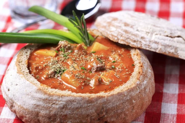 Goulash in a bread bowl — Stock Photo, Image