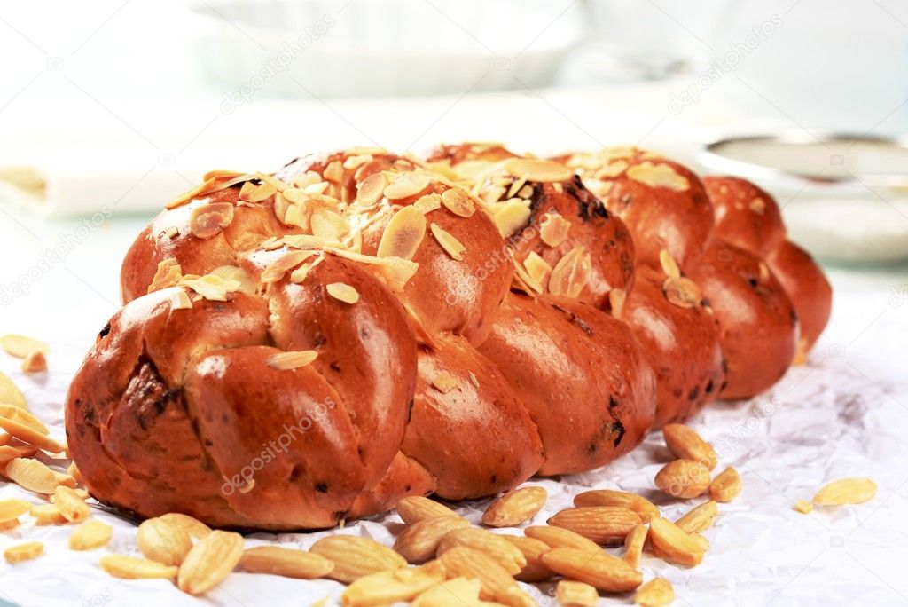 Sweet Christmas braided bread with almond chips on top