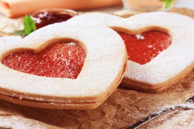 Heart shaped shortbread cookies with jam filling clipart