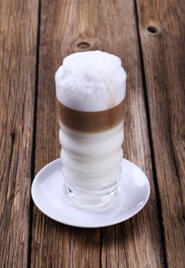 Glass of Latte macchiato with milk foam clipart