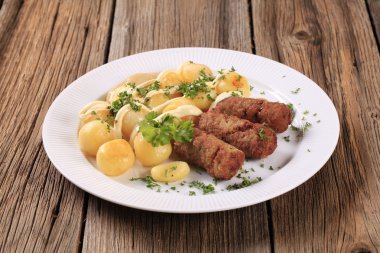 Cevapcici and potatoes clipart