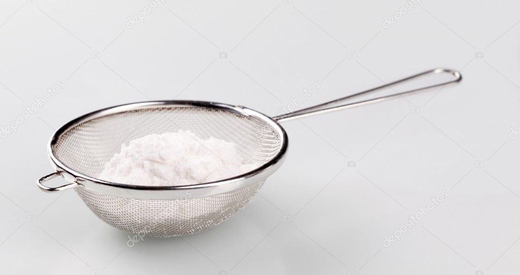 Powdered sugar in a sieve