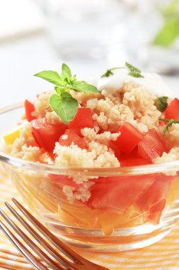 Couscous with fresh tomato and yellow pepper clipart