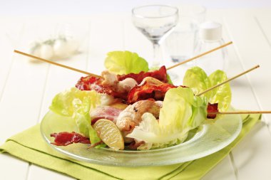 Chicken skewers and crispy bacon clipart