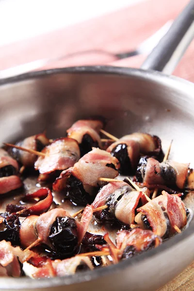 Bacon wrapped prunes — Stock Photo, Image