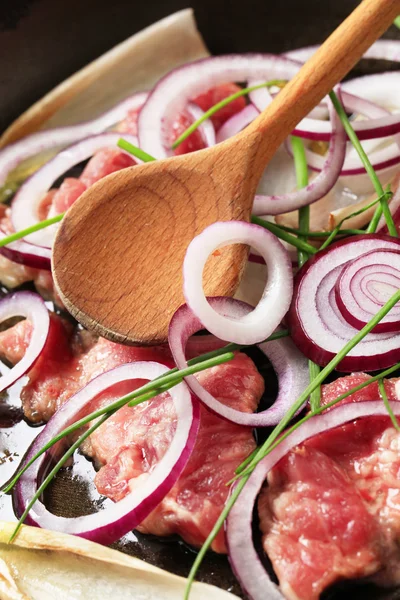 Pan frying pork and onion — Stock Photo, Image