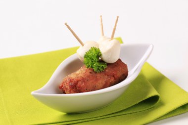 Minced meat kebab and baby mozzarella clipart