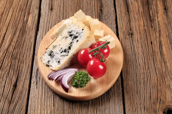 Cheese on a cutting board — Stock Photo, Image