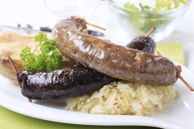 Sausages, sauerkraut and baked potato clipart