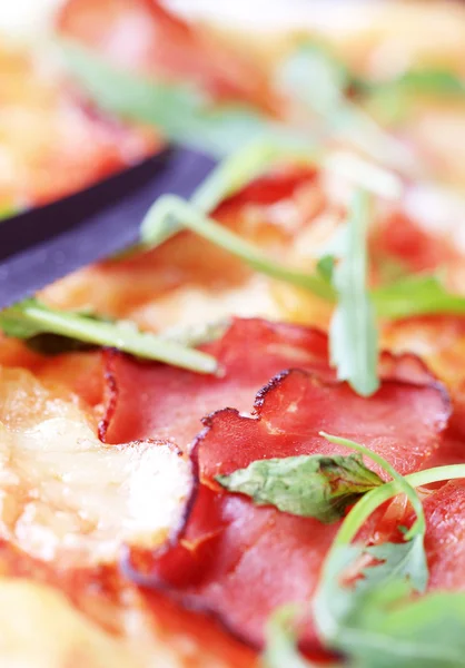 stock image Slices of proscuitto on pizza