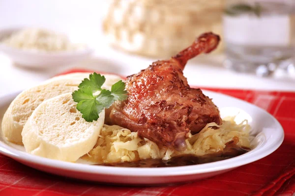 Roast duck with sauerkraut and dumplings — Stock Photo, Image