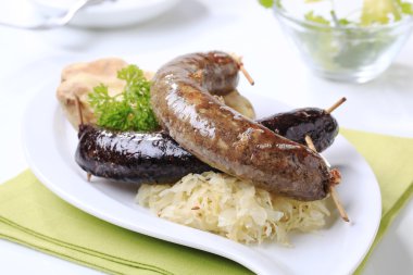 Sausages, sauerkraut and baked potato clipart