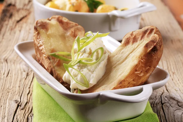 Baked potato and cream cheese — Stock Photo, Image