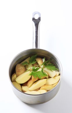 Potatoes in a saucepan clipart
