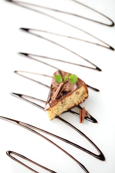 Nut cake with chocolate icing — Stock Photo, Image