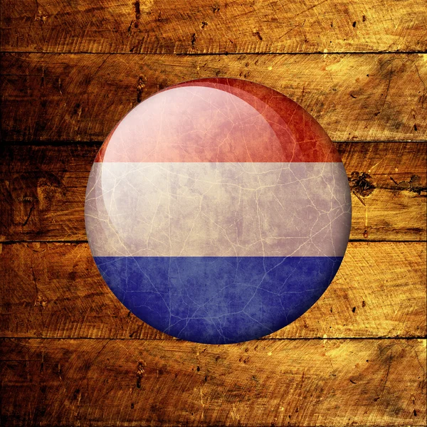 Grunge netherlands Bandeira em um fundo de madeira — Fotografia de Stock