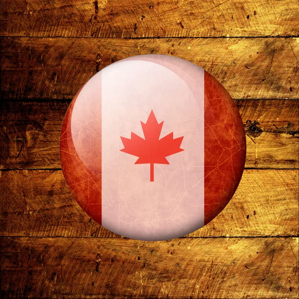Bandiera canadese Grunge su uno sfondo di legno — Foto Stock