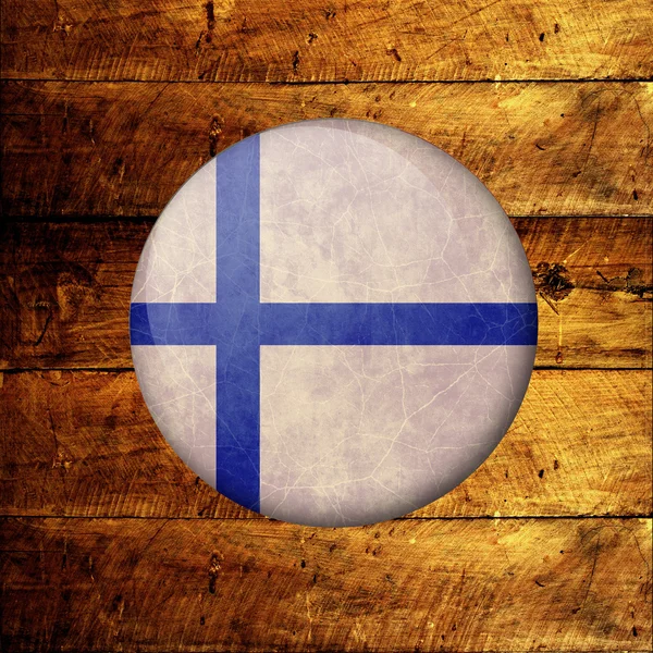 Finnish Grunge Flag on a wooden background — Stock Photo, Image