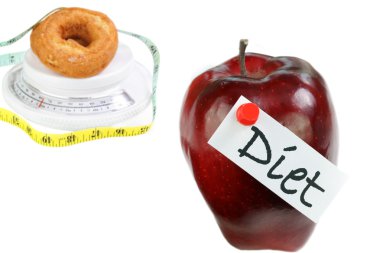 Diet Concept with Apple and Doughnut on white with copy space. clipart
