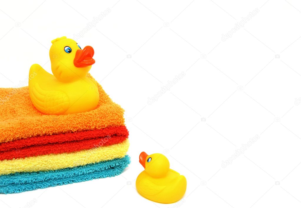 Mom and baby rubber ducks on white
