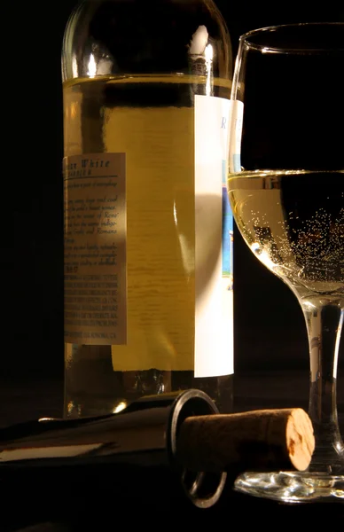 stock image White wine with bottle and cork screw